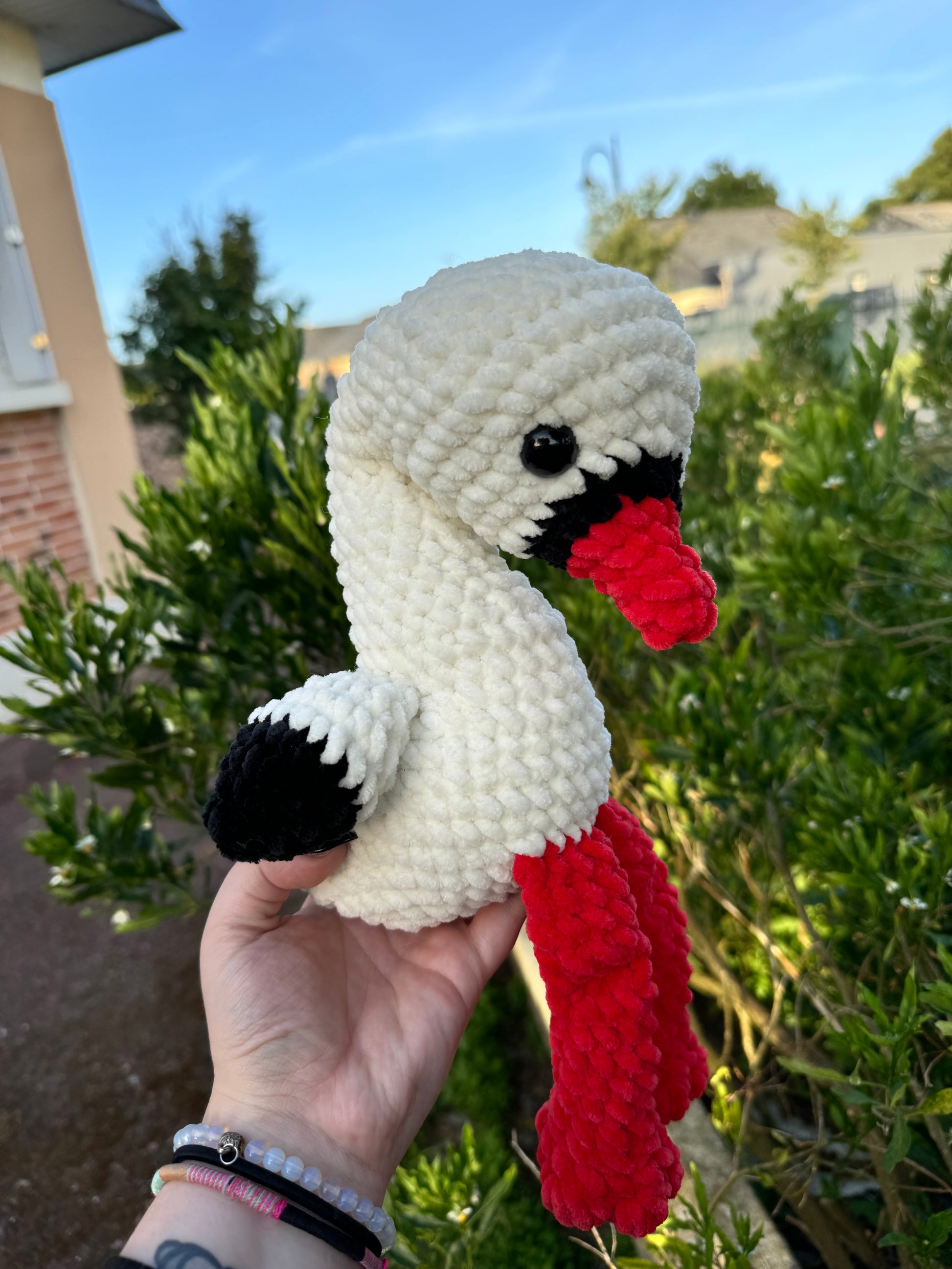 peluche cigogne alsace au crochet fait main en France amigurumi cigogne crochet